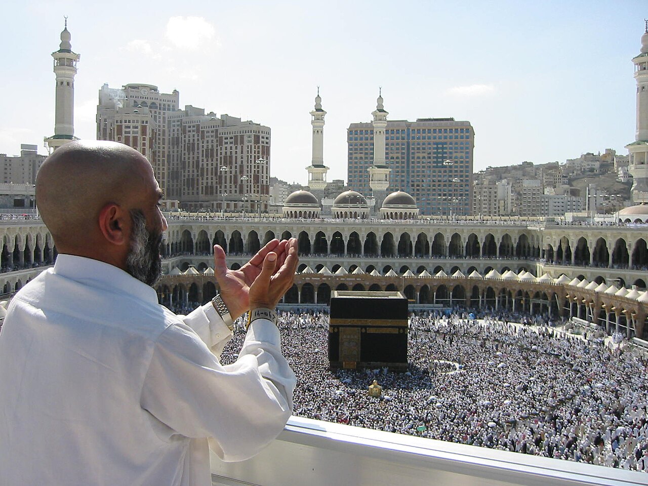 Elderly Pakistani pilgrim making dua overlooking the Kaaba